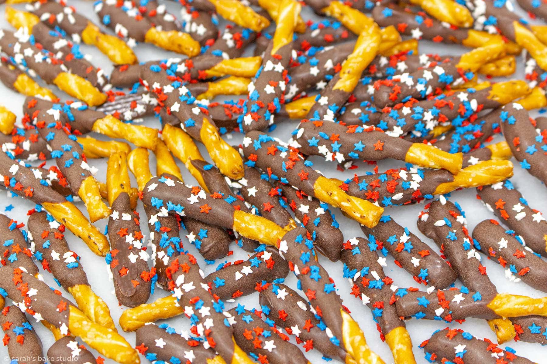 a scatter of patriotic chocolate pretzel sticks