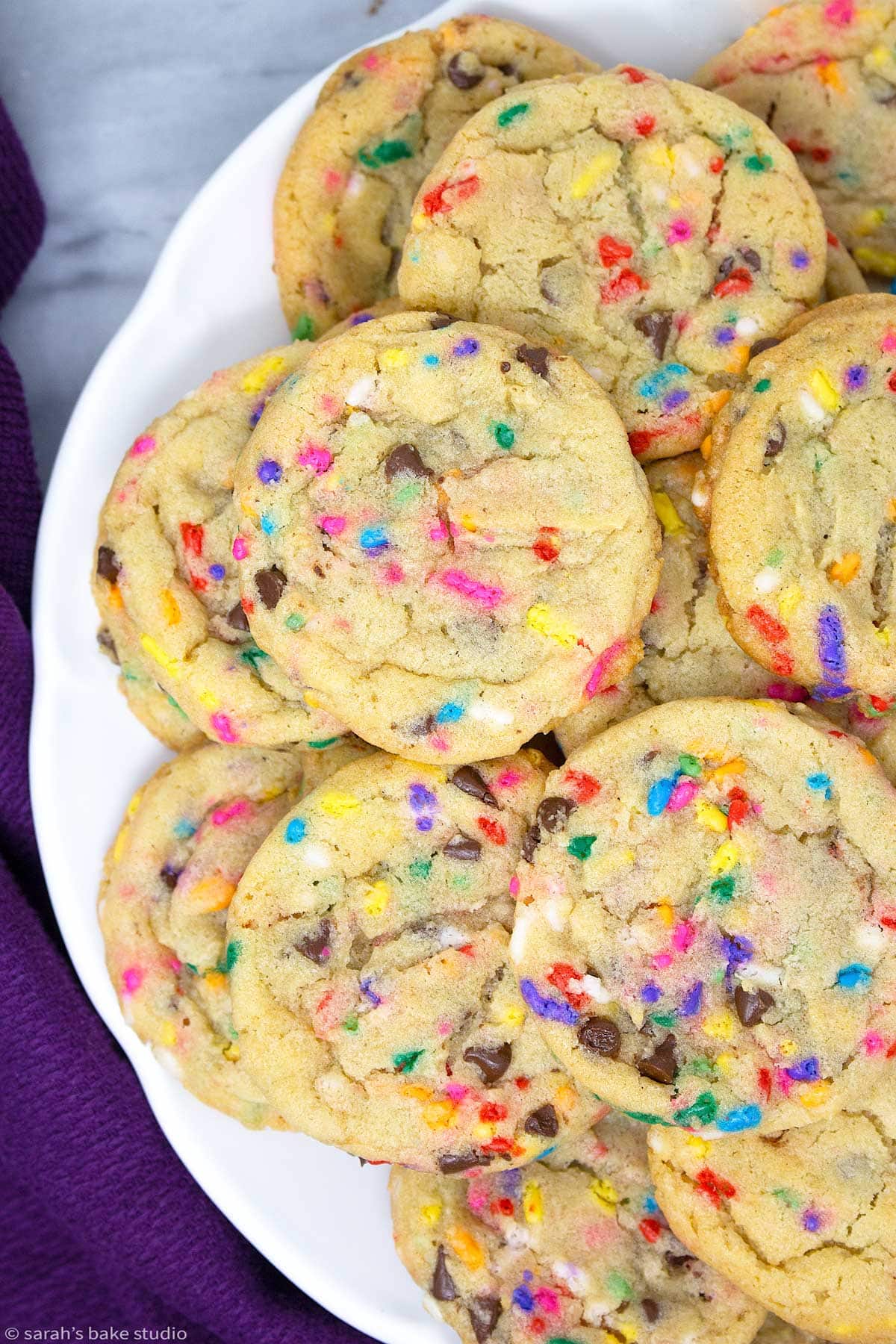 an up close look at chocolate chip cake batter cookies on a plate
