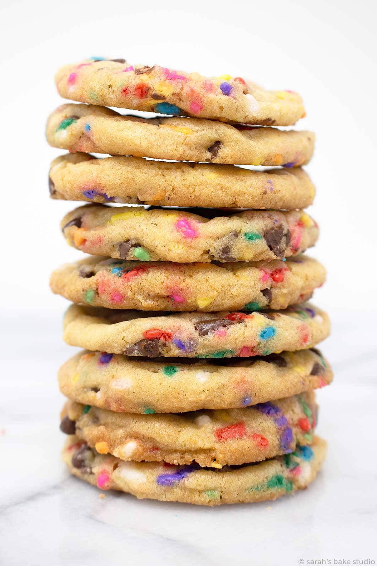 a side view of chocolate chip cake batter cookies stacked in a tower