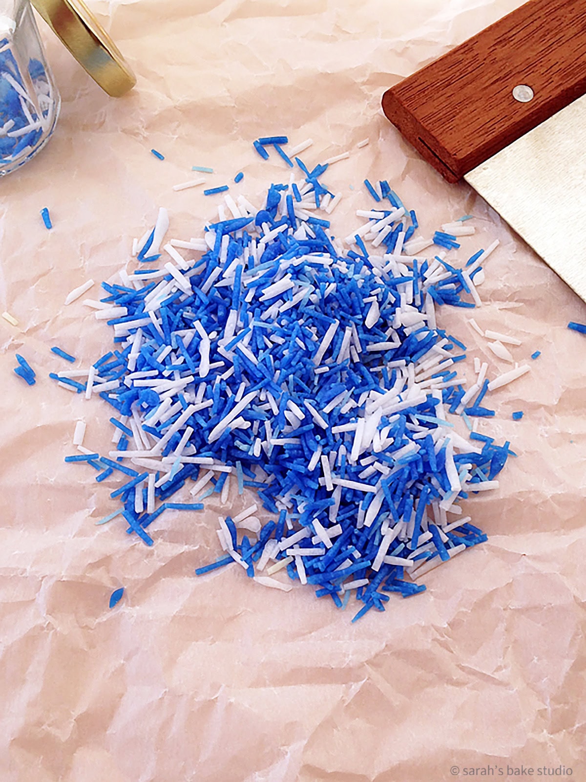 A pile of blue and white homemade sprinkles.