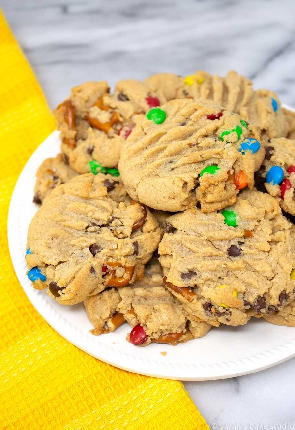 Loaded Peanut Butter Pretzel Cookies - soft, super duper peanut butter cookies loaded with crunchy pretzel pieces, mini chocolate chips and colorful mini M&M's candies; a scrumptious sweet and salty cookie delight.