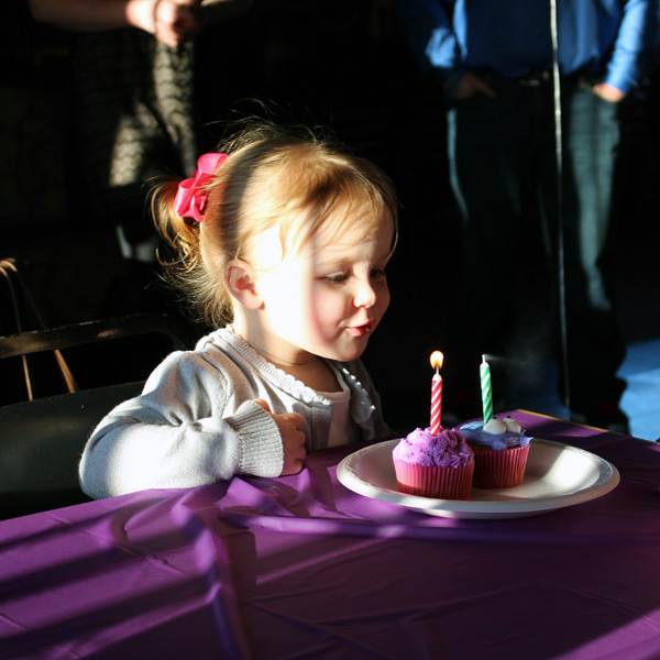Niece Blowing Out Birthday Candles