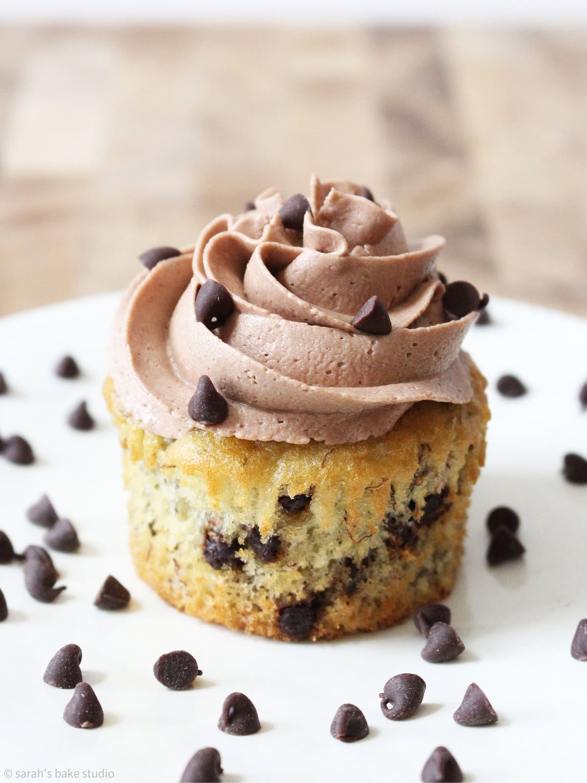 A Banana Chocolate Chip Cupcake with Chocolate Buttercream up close.