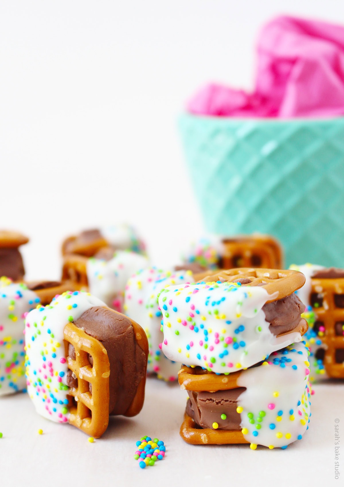 A bowl and a small pile of Milky Way Pretzel Bites.