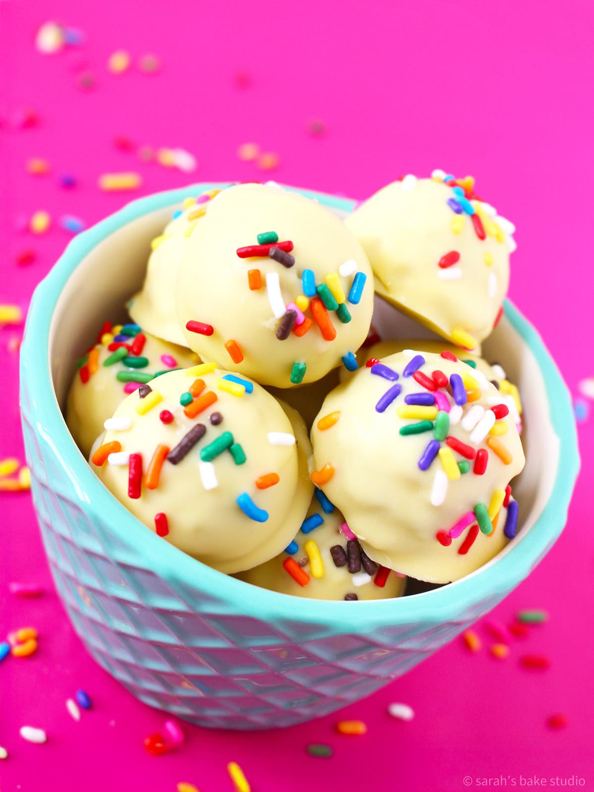 A bowl filled with Birthday Cake Oreo Truffles.