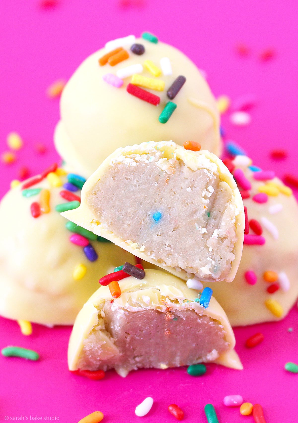 A Birthday Cake Oreo Truffle cut in half.