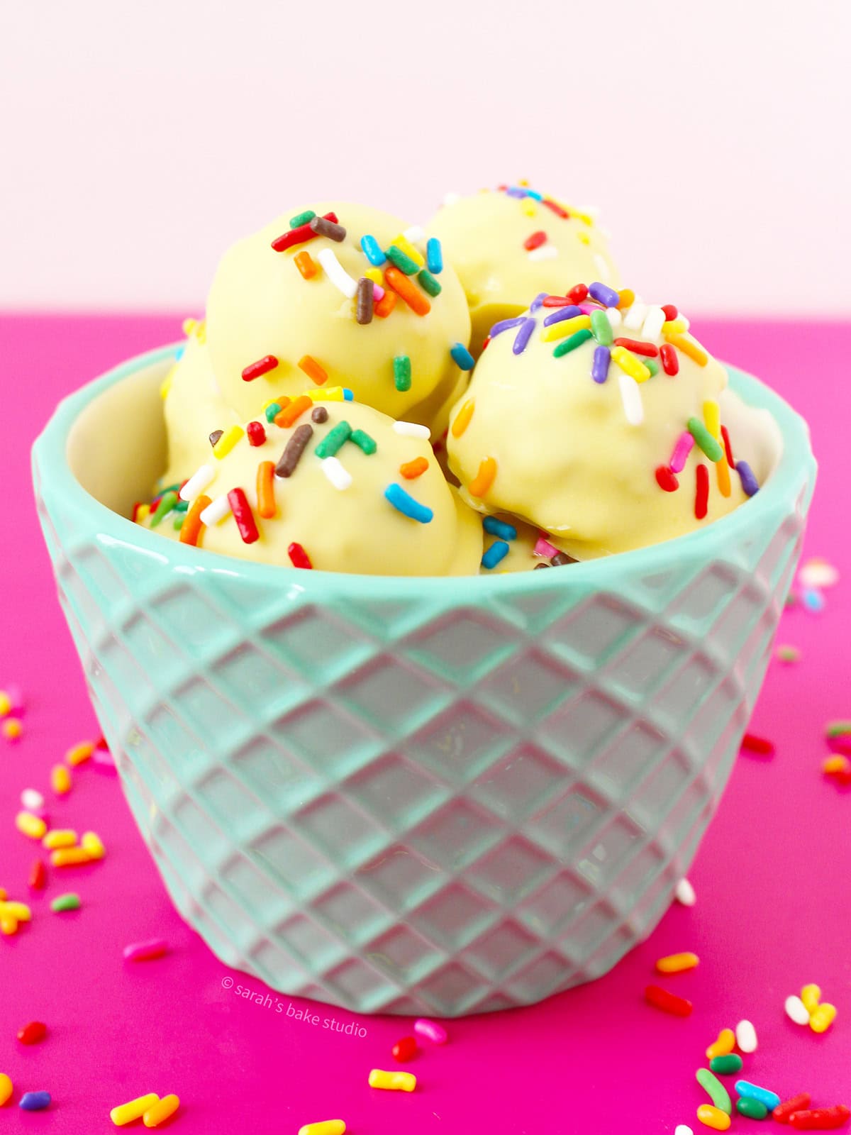 A bowl filled with Birthday Cake Oreo Truffles.