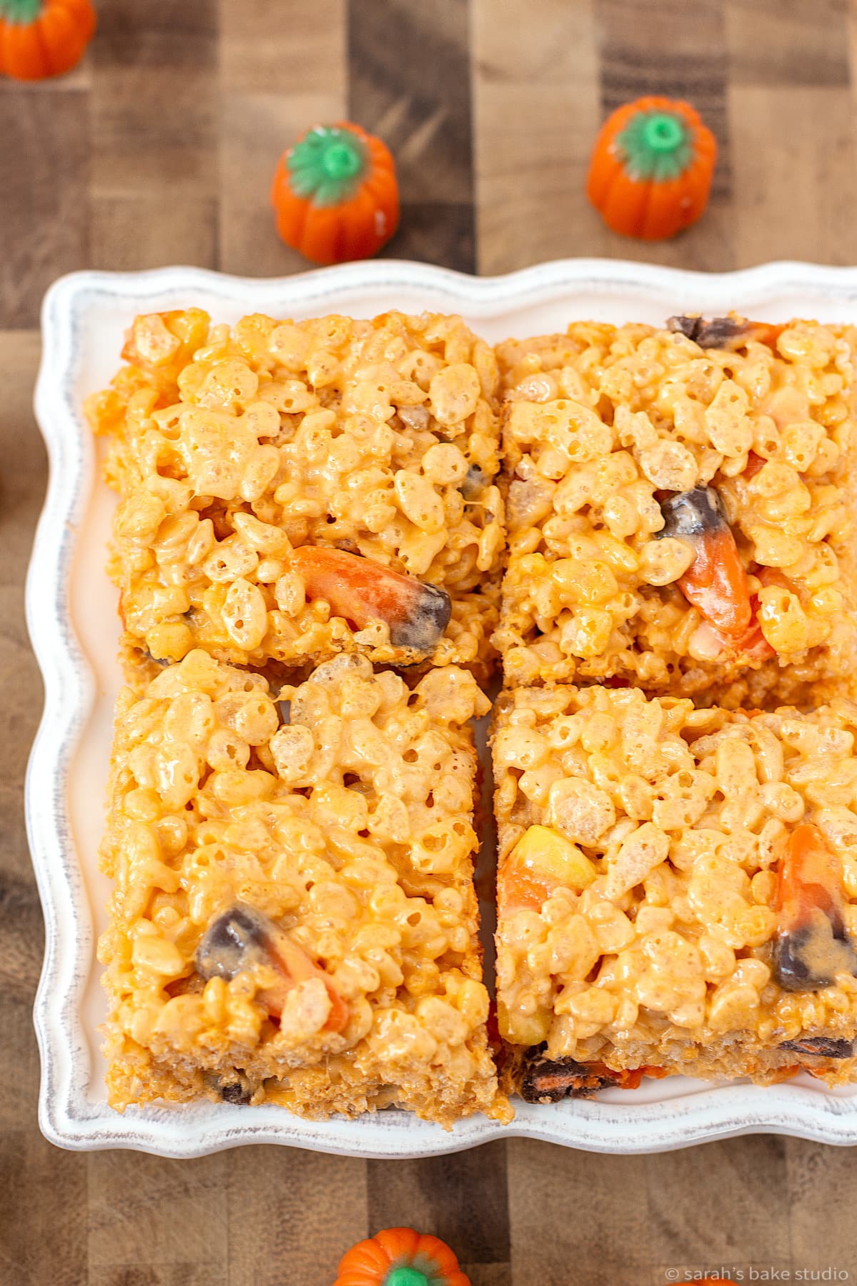 A plate stacked with Candy Corn Rice Krispies Treats.