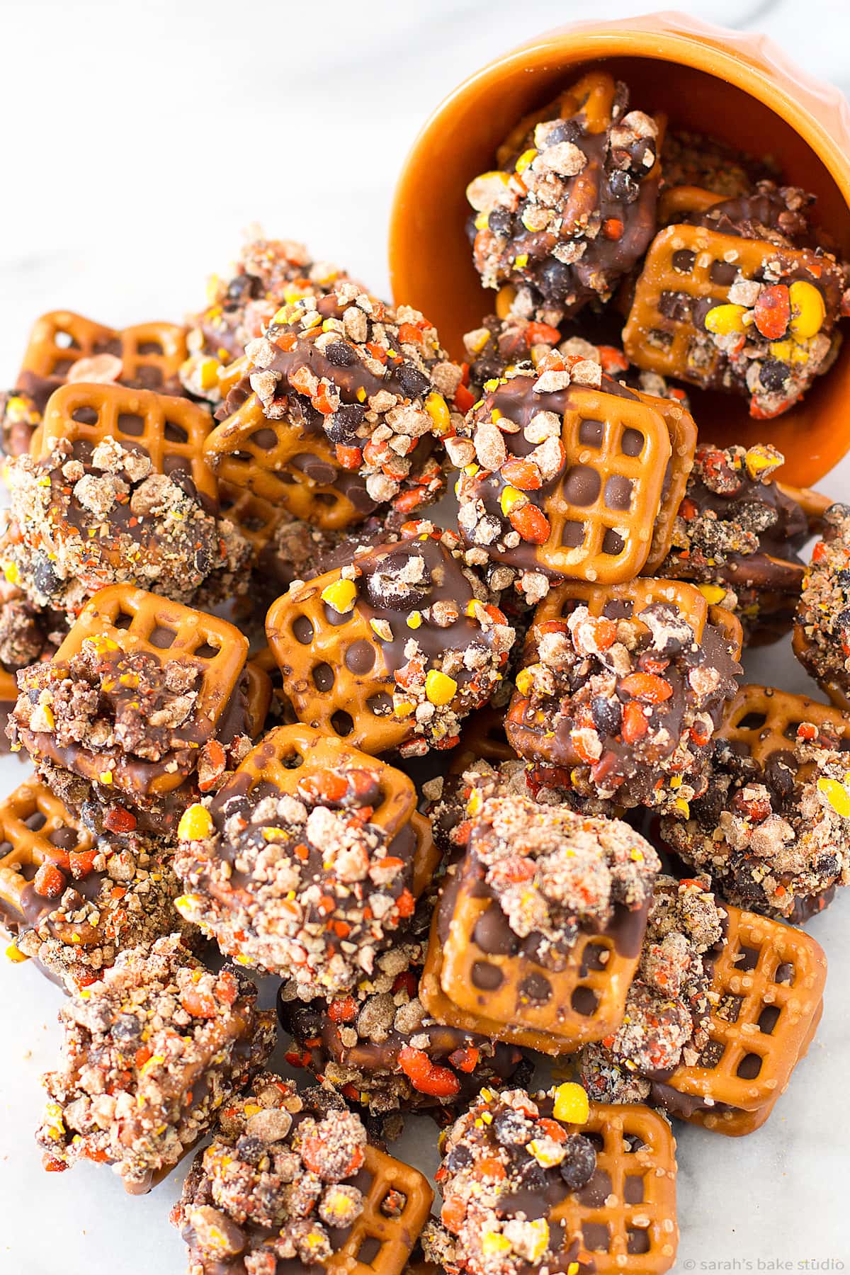 A bowl with Reese's Peanut Butter Pretzel Bites spilling out.