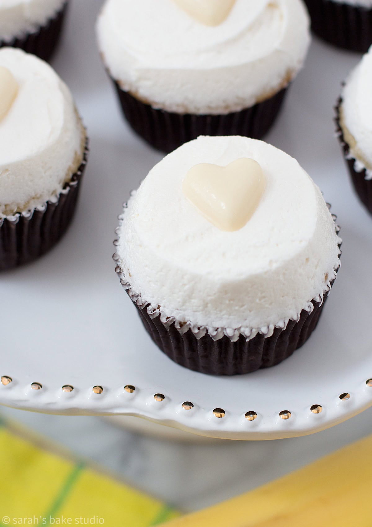 A cake plate with Very Banana Cupcakes.