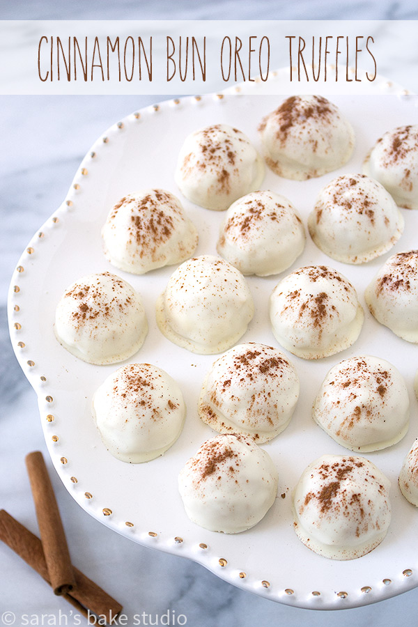 Cinnamon Bun Oreo Truffles – crushed Cinnamon Bun Oreo Cookies combined with cream cheese, scooped into bite-sized balls, dipped into melted white chocolate, and sprinkled with cinnamon!