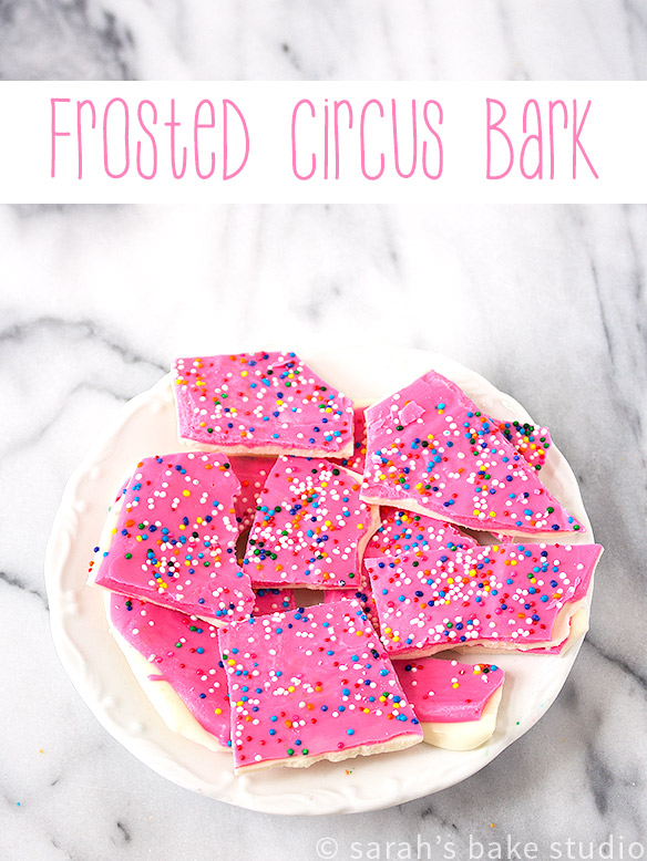 Frosted Circus Bark – melted white chocolate and pink chocolate wafers layered and decorated with colorful nonpareils; like Frosted Circus Animal Cookies but without the animals and cookies.