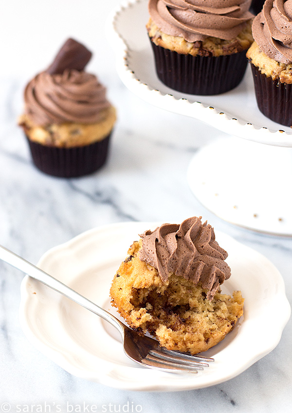 Peanut Butter Heath Cupcakes – a delectable doctored cake mix peanut butter cupcake with Heath Milk Chocolate Toffee Bits, topped with a fluffy cloud of chocolate buttercream and a Heath Miniatures.