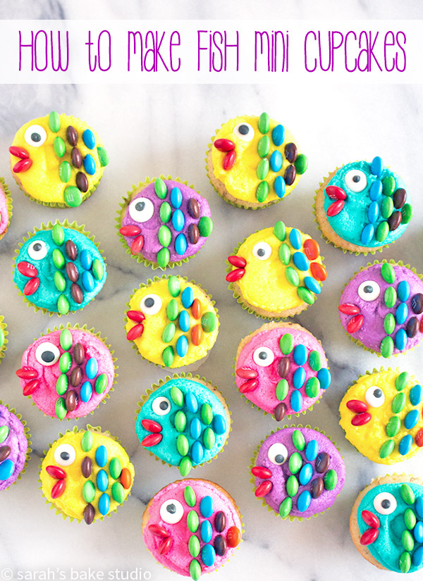 How to Make Fish Mini Cupcakes – dress up your mini cupcakes with colorful buttercream, royal icing eyes, and mini M&M’s candies to create a fun and delightful sea of mini cupcake fish!