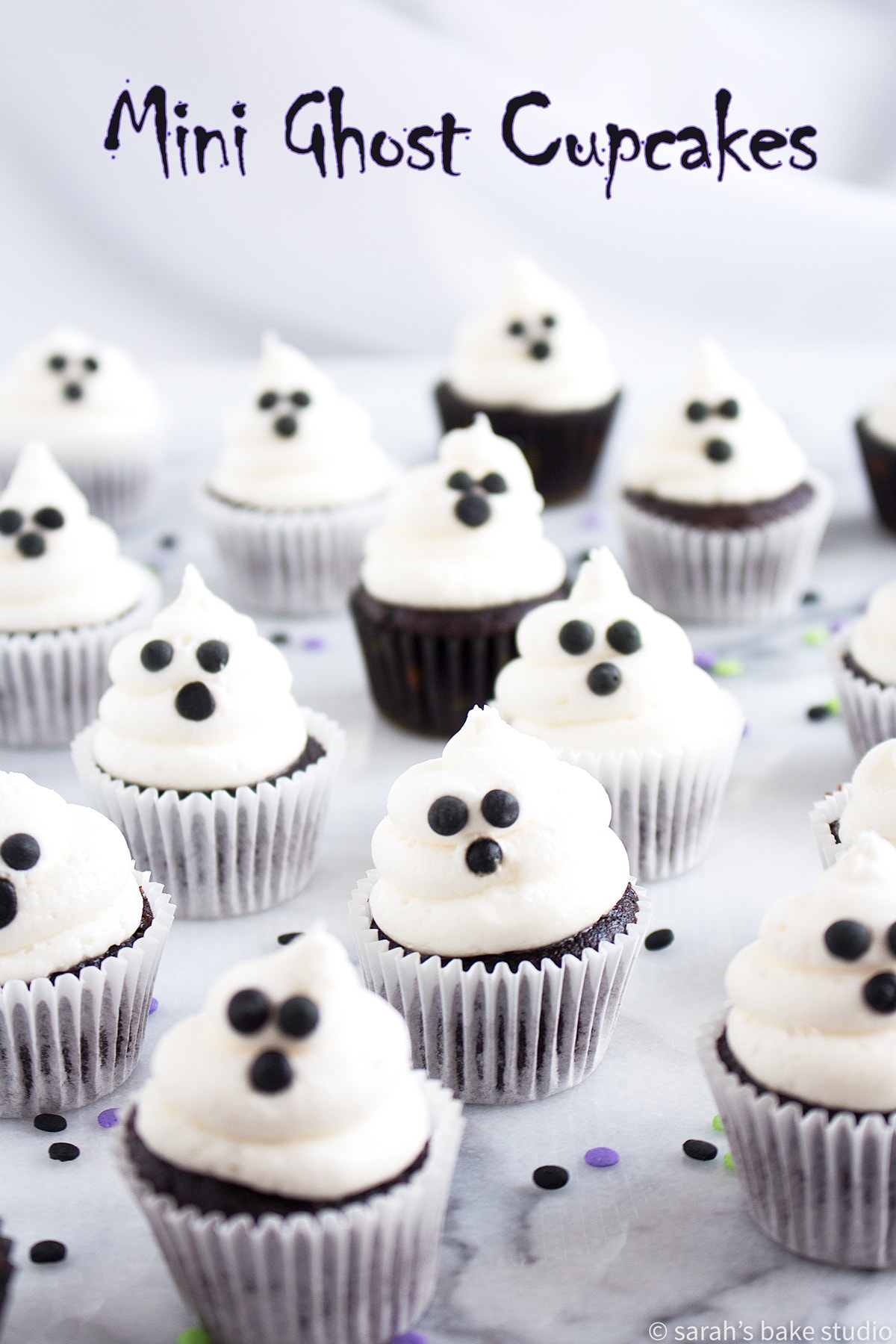 A front view of Mini Ghost Cupcakes.