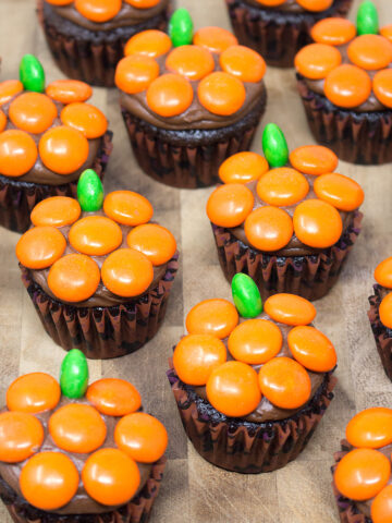 A flatlay of Pumpkin M&M Mini Cupcakes.