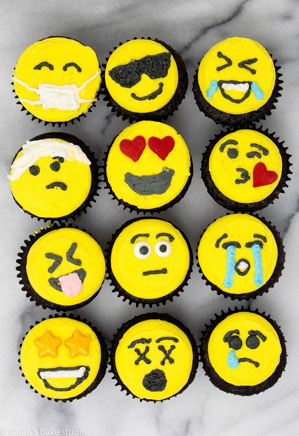 Emoji Mini Cupcakes - get emotional with these cute mini cupcakes adorned with bright yellow emoji faces.