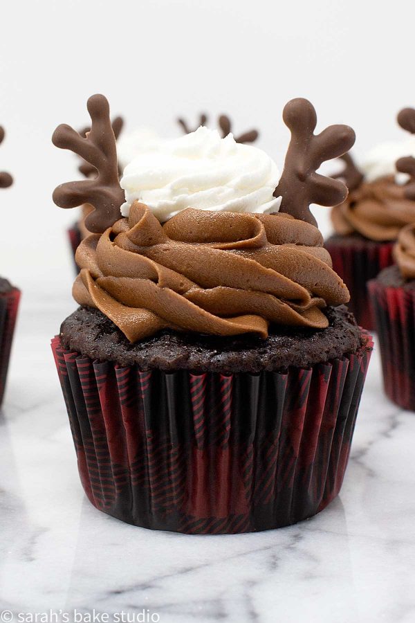 Antler Cupcakes - your favorite chocolate cupcake recipe piled high with chocolate and vanilla buttercream and adorned with homemade chocolate antlers; a positively perfect woodland creatures cupcake.