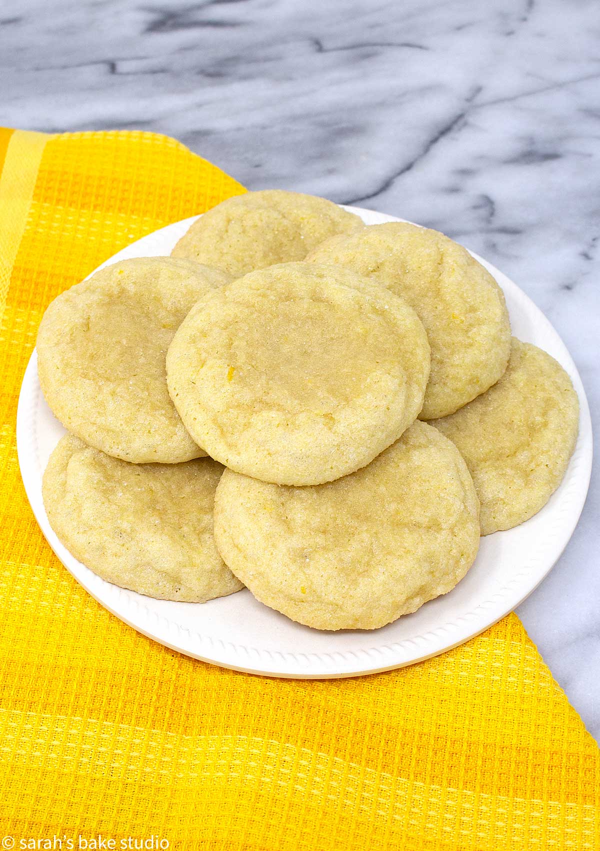 Chewy Lemon Sugar Cookies - deliciously simple sugar cookies with lemon extract, lemon juice, and lemon zest, making these soft and chewy lemon sugar cookies refreshingly lemon.