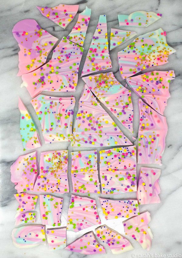 White Chocolate Unicorn Bark – colorful, melted white chocolate swirled together and topped with copious amounts of sprinkles make this unicorn inspired white chocolate magnificent fun and magically delicious.