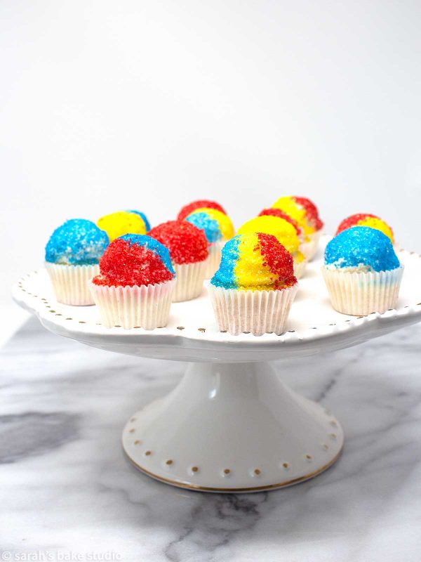 Snow Cone Mini Cupcakes - easy-breezy, delightfully cute mini cupcakes adorned with colorful sanding sugar to resemble delicious snow cones; a fun and delish way to celebrate summer with just one bite.