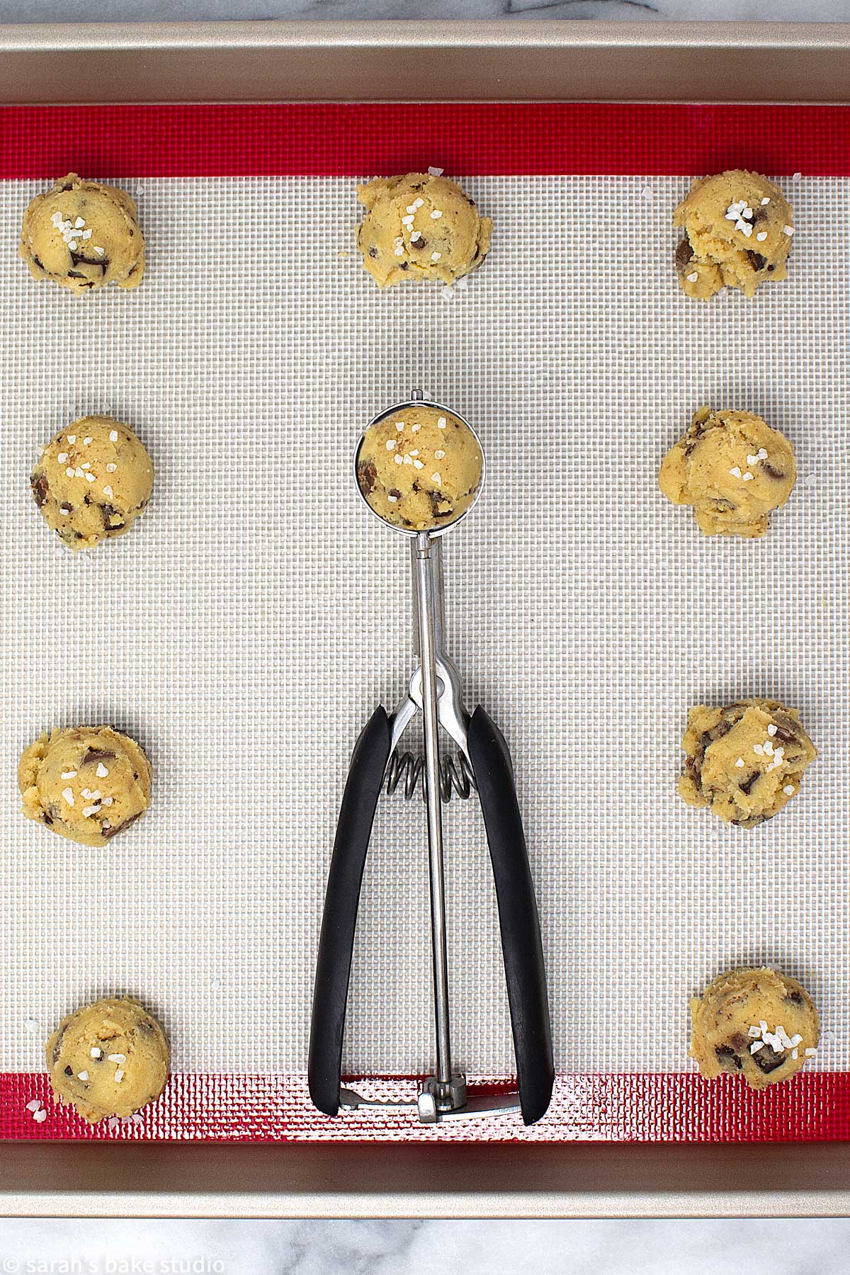Salted Chocolate Chip Cookies - a delicious sweet and salty twist to soft and chewy chocolate chip cookies with the addition of both milk and dark chocolate chips and sea salt. #OXOBetter #OXOGoodCookies