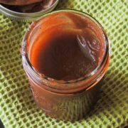 a glass mason jar filled with apple butter.