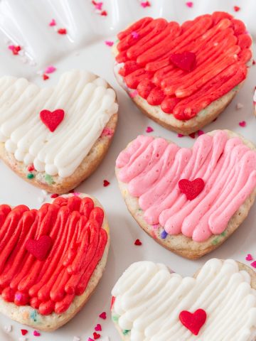 up close on a plate of heart funfetti cookie cake bars
