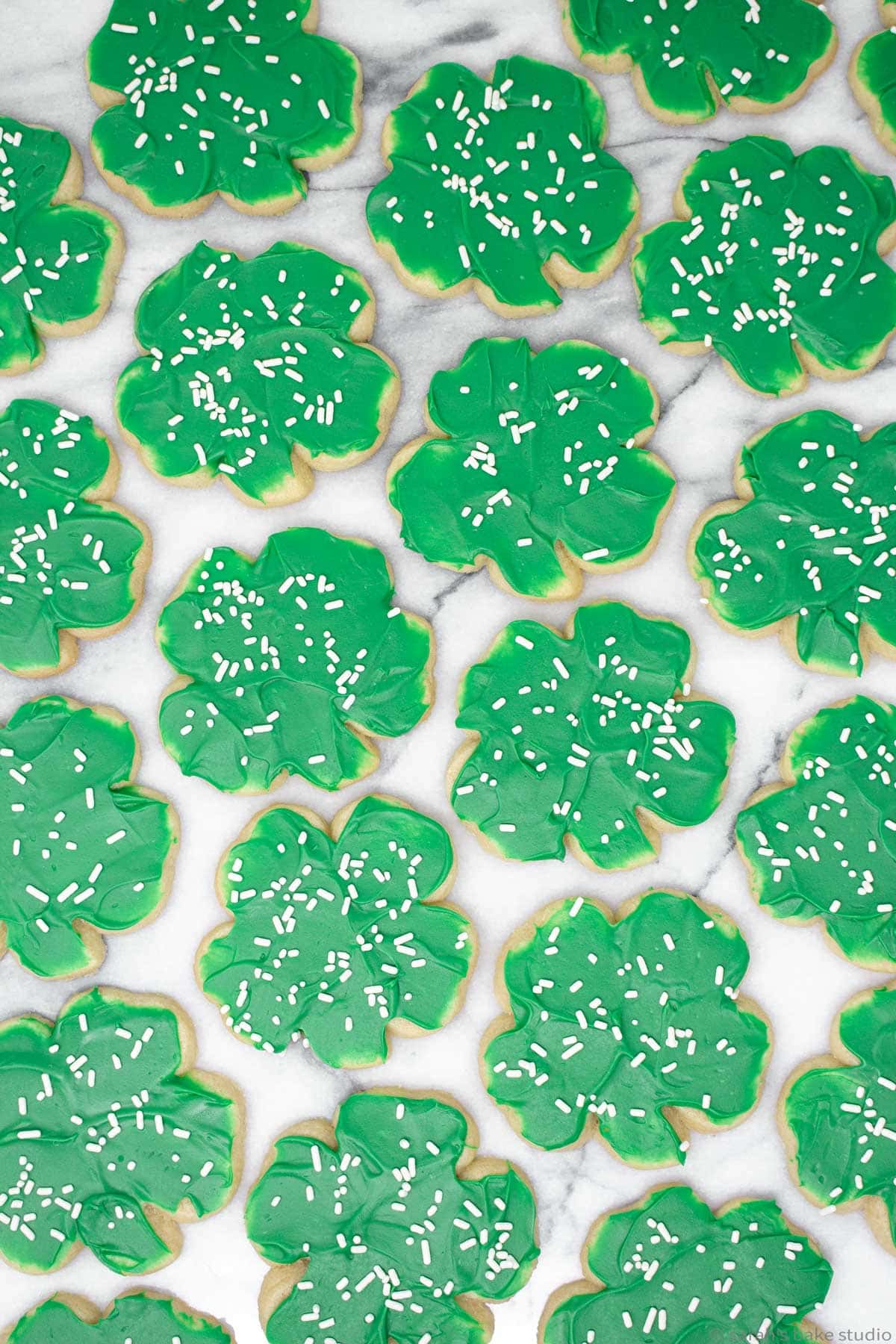 a flatlay of four-leaf clover decorated cookies.