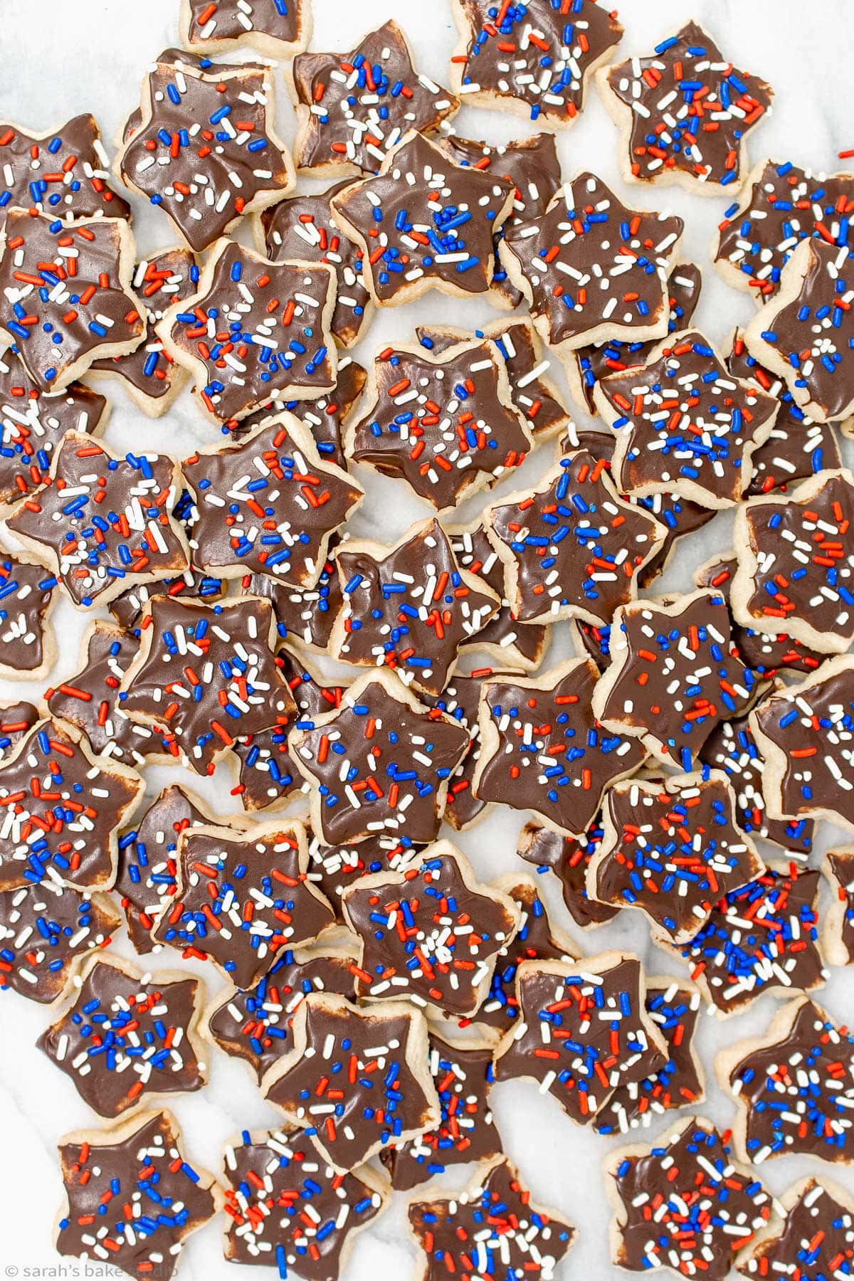 an array of patriotic star sugar cookies stacked on each other