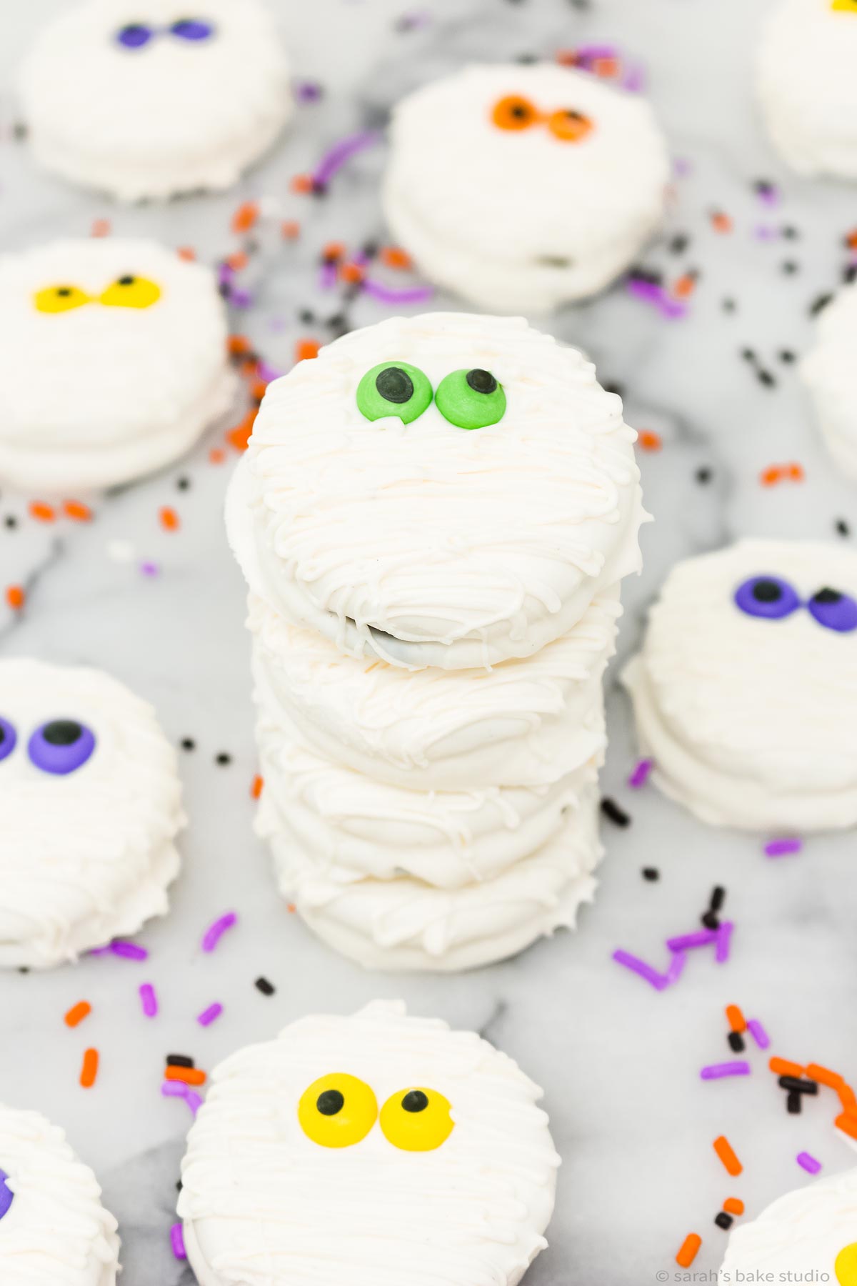 Halloween Mummy Oreo Cookies stacked into a tower.