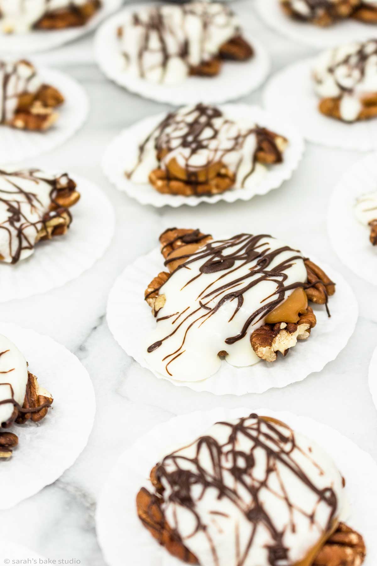 Caramel Pecan Turtles - soft gooey caramel, sweet white chocolate, and toasted pecan nutty goodness.