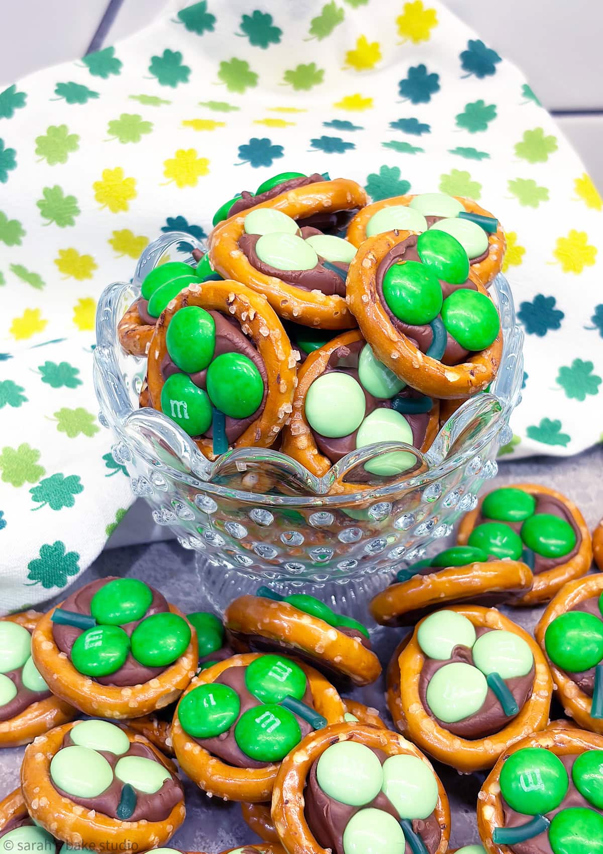 A glass bowl filled with Shamrock Pretzel Bites.
