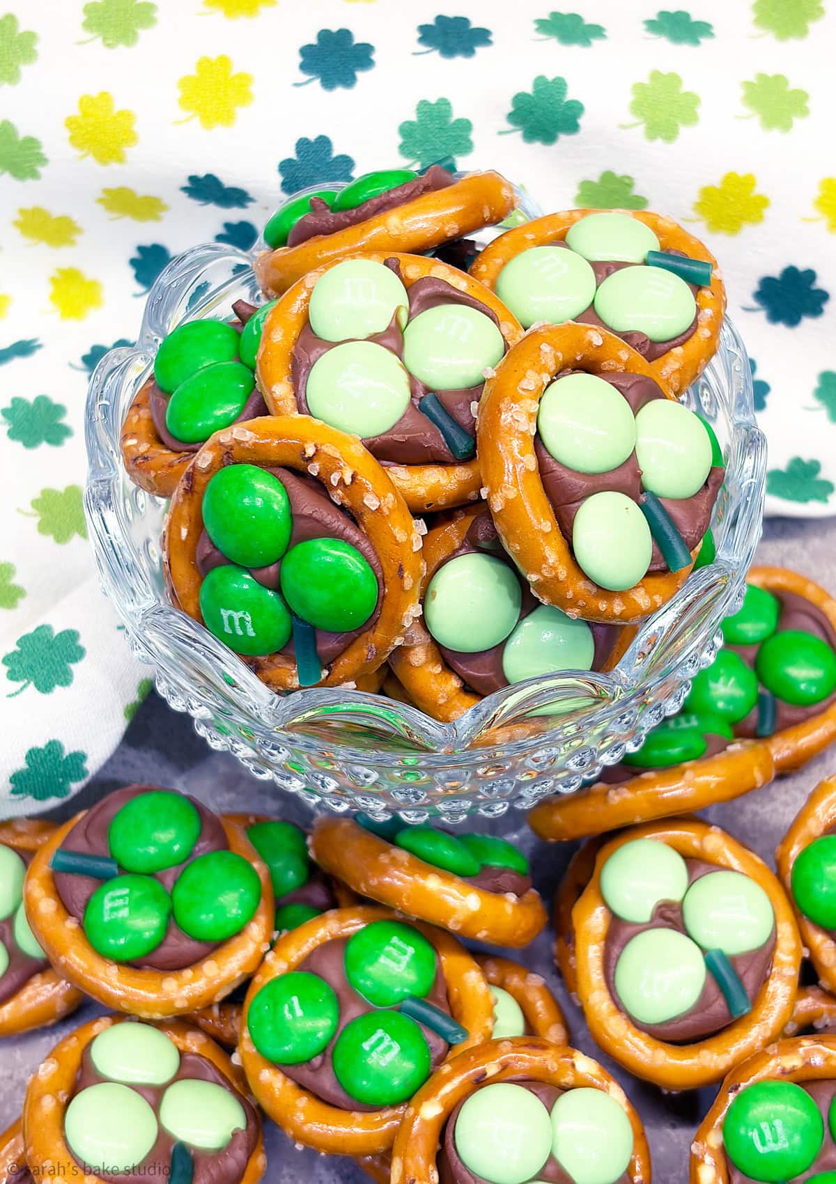 A glass bowl filled with Shamrock Pretzel Bites.