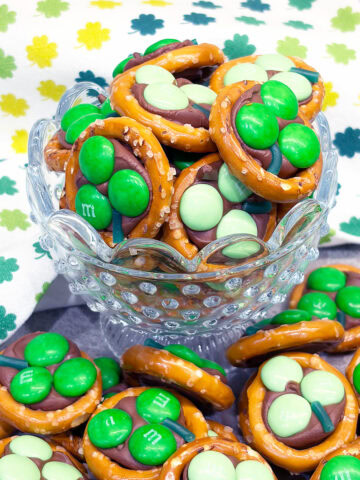 A glass bowl filled with Shamrock Pretzel Bites.