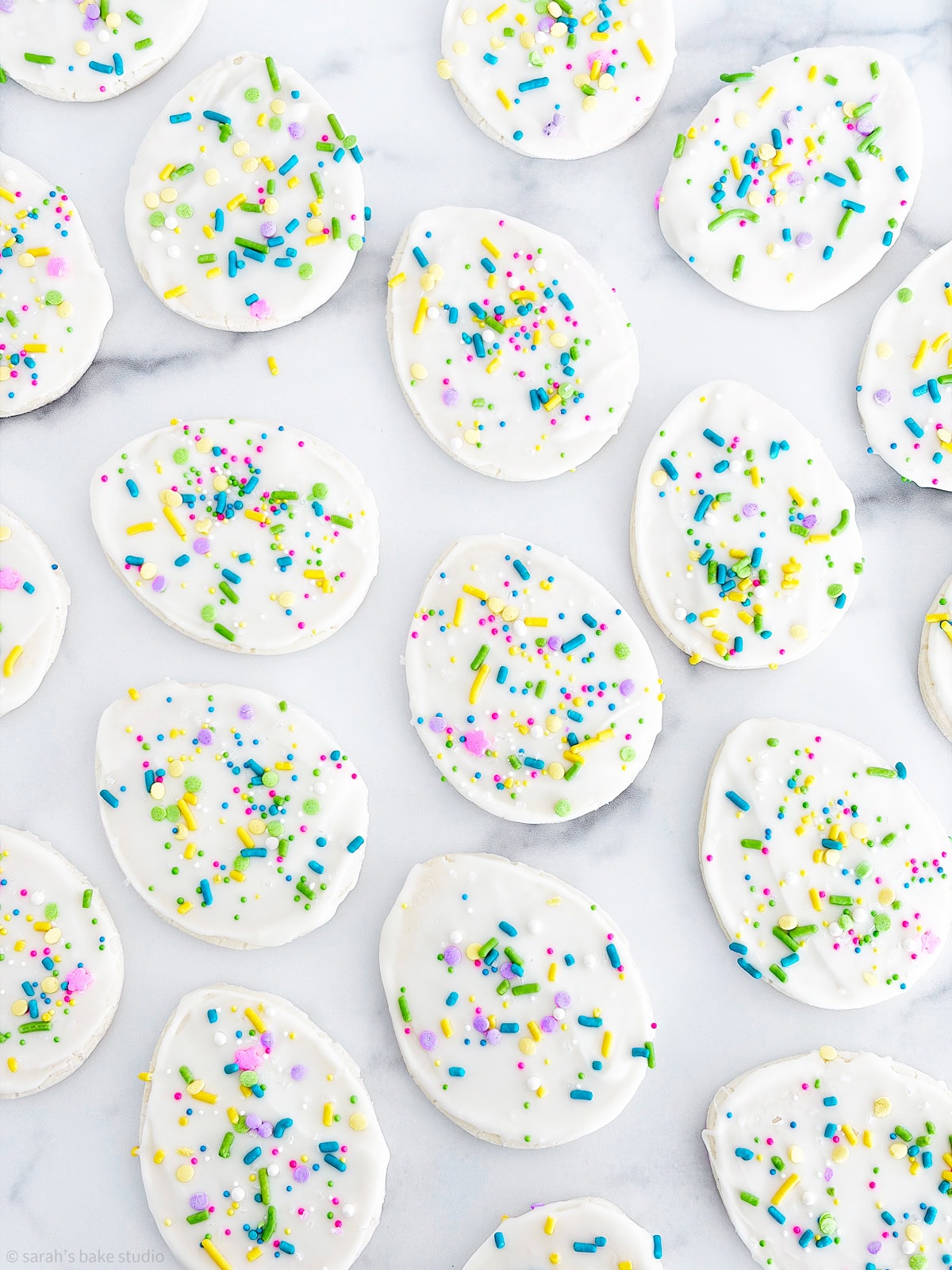 A flatlay of White Chocolate Easter Egg Sugar Cookies.